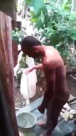 Latin man taking a shower