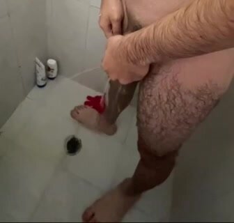 Hairy guy pissing while showering