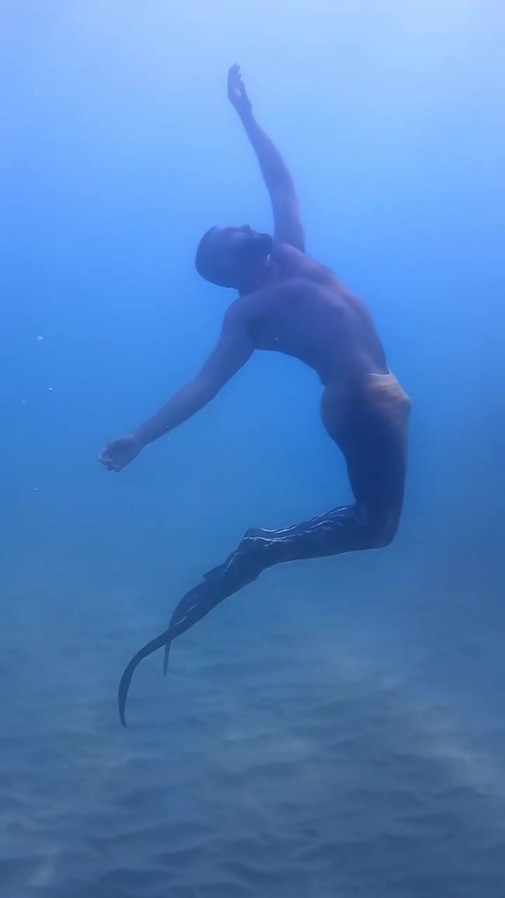 Underwater barefaced merman bulging
