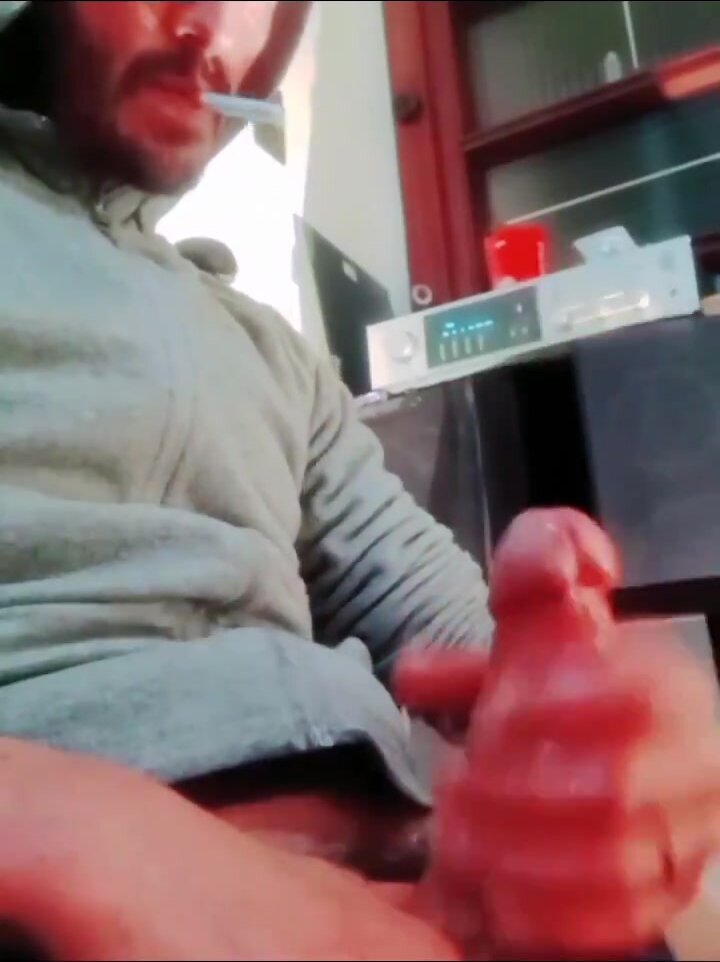 Uncut stud smokes and edges his dong to orgasm