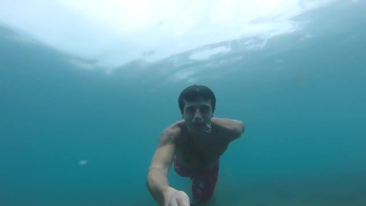 Barefaced cutie diving barefeet underwater