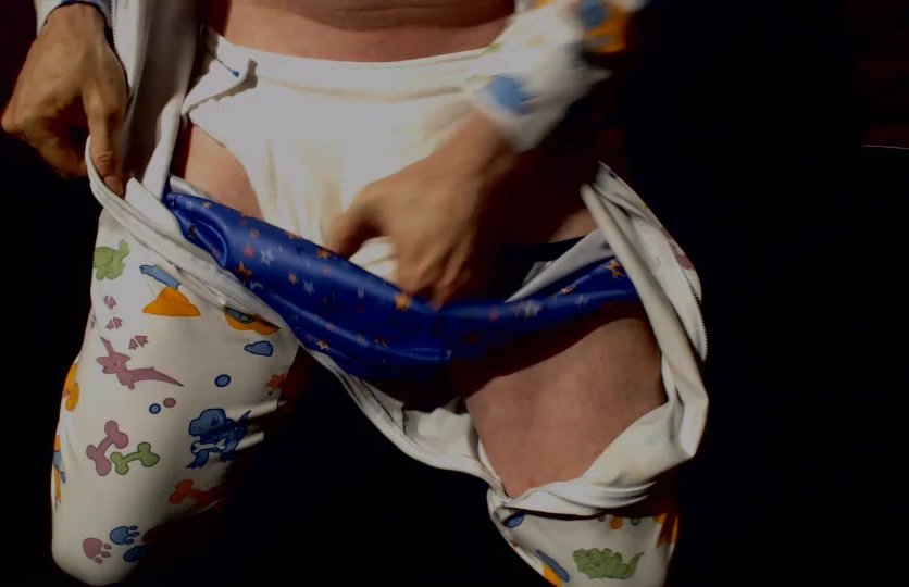 Playing in wet cloth diaper