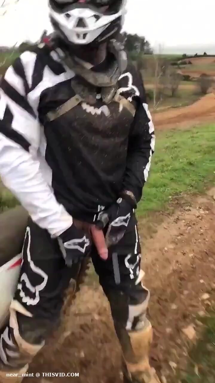 Biker peeing next to biker friend with a semi hardon