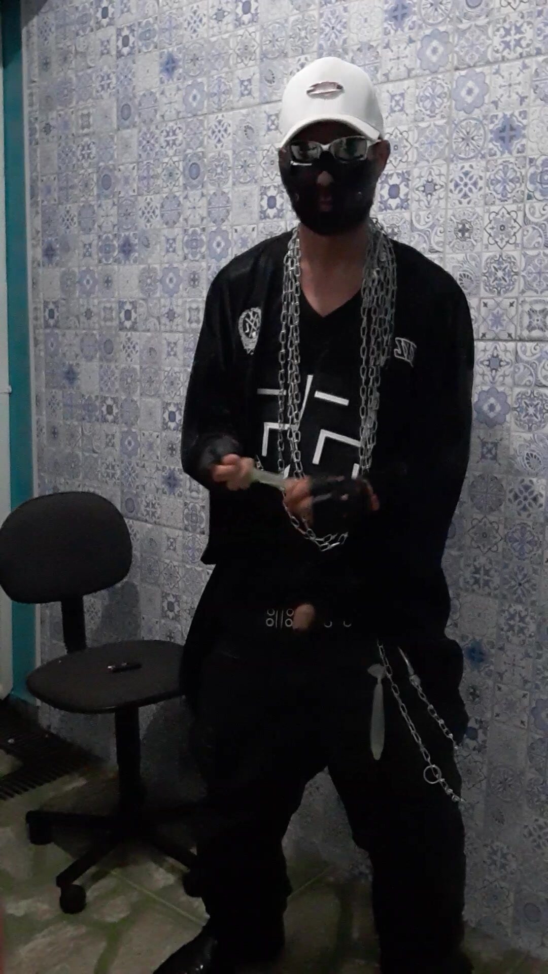 Scally boy baggy leather pissing in condom and smoking