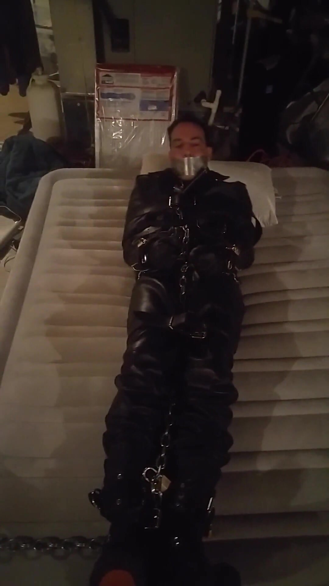 Captured, Straitjacketed, Gagged and Chained