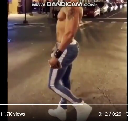 dude with a tight body walking down the street