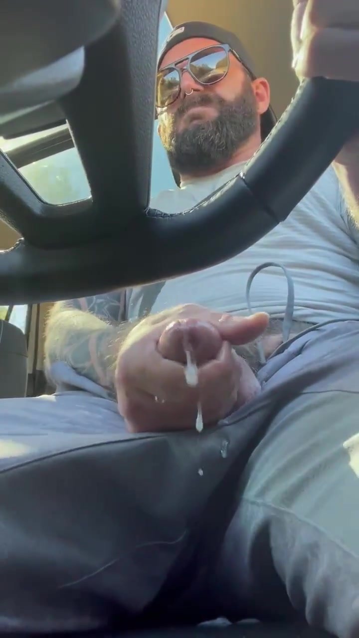 Bearded stud busts a nut in his truck