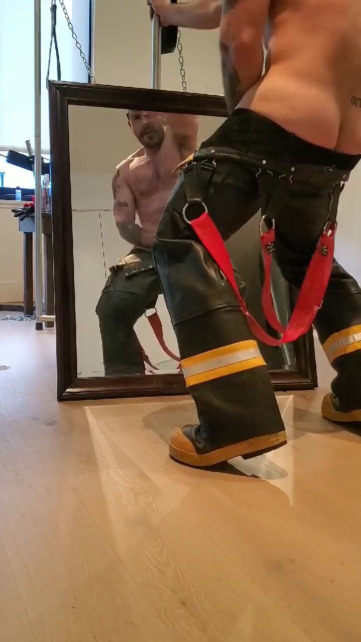 Pig in firefighter gear plasters mirror