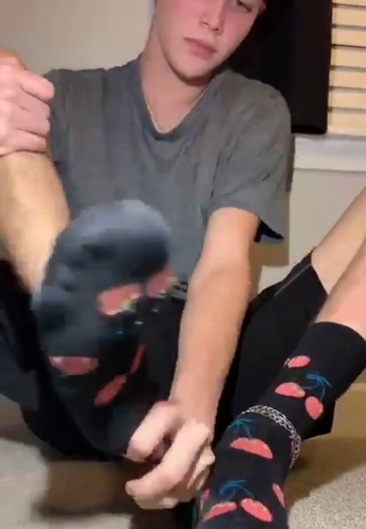 Boy showing his feet and socks 1