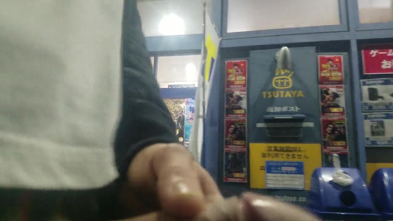 Dickflash and cumshot in video rental shop