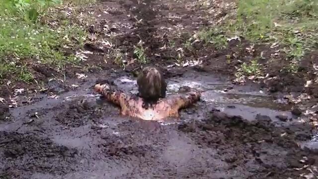 swimsuit girl in deep mud pool