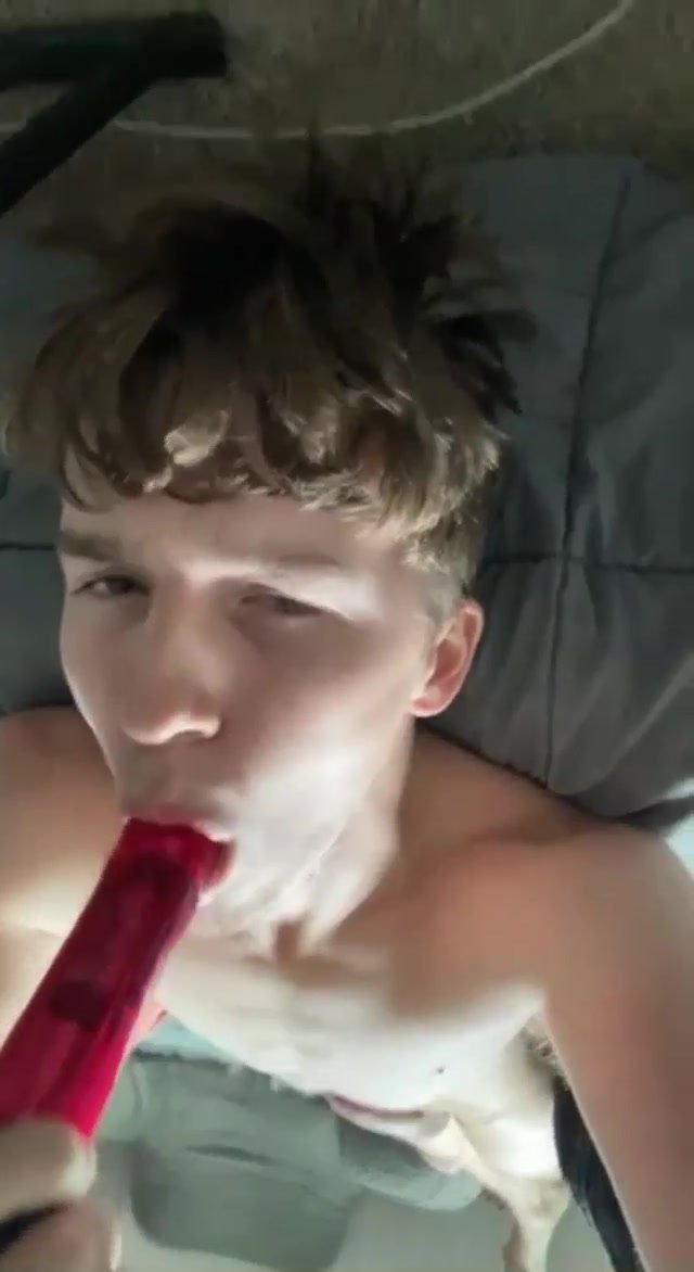 Cute young fag exposes himself sucking dildo