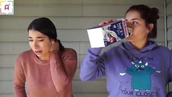 Two sisters puking milk