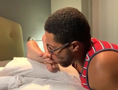 Guy gets his feet worshipped