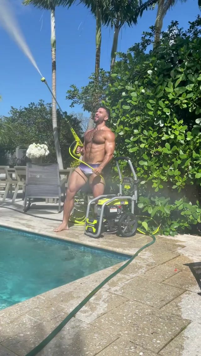 Hot hairy muscle guy working on the pool