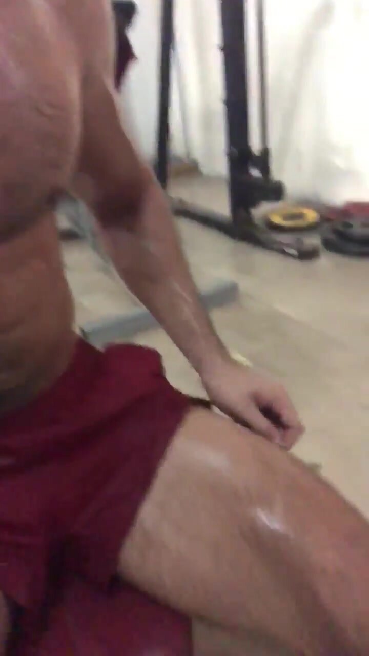Sweaty hairy muscle guy at the gym