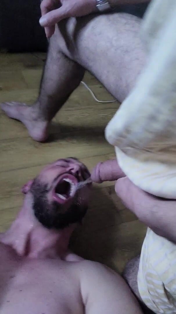 Muscle Bearded Pissing by another