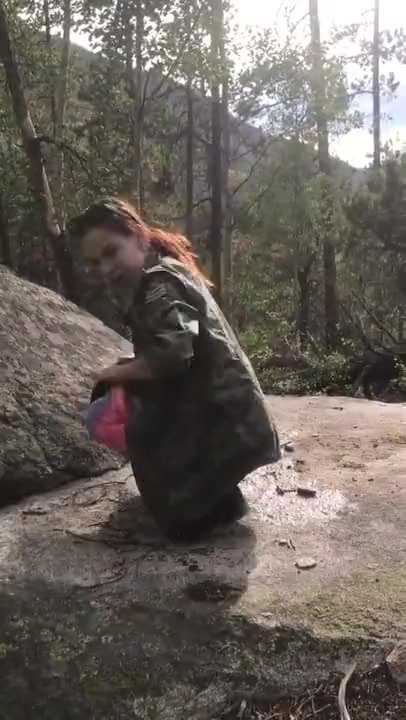 duo friend pee on a rock