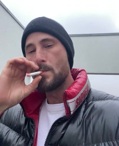 Smoking in puffer jacket