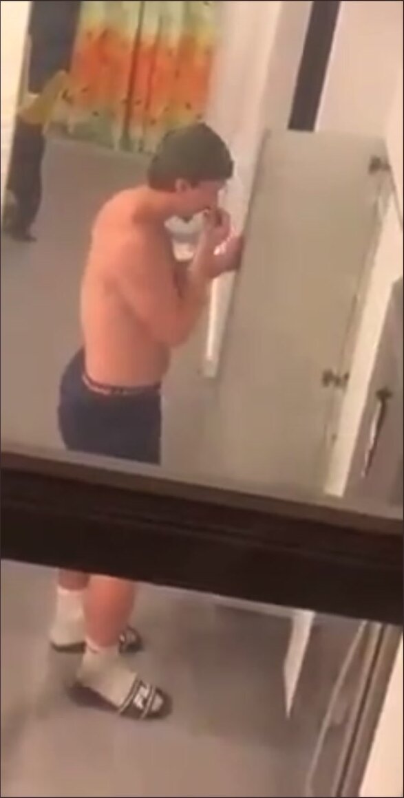 Sexy man sniffs his ass