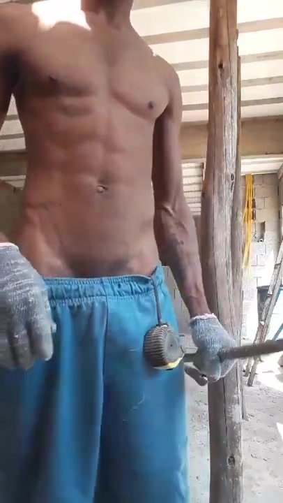Brazilian construction worker showing off