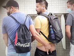 Lads having fun in public bathroom