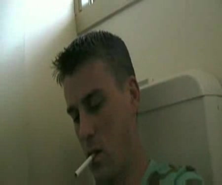 Hunky Guy in green t shirt smokes and pisses in the bog