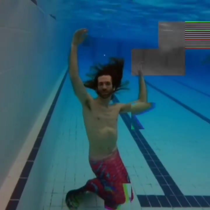 Long haired barefaced merman underwater