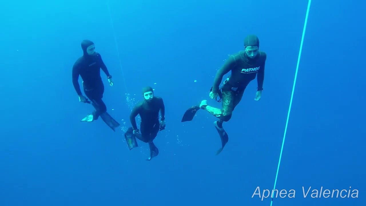 Spanish freedivers ripping masks underwater