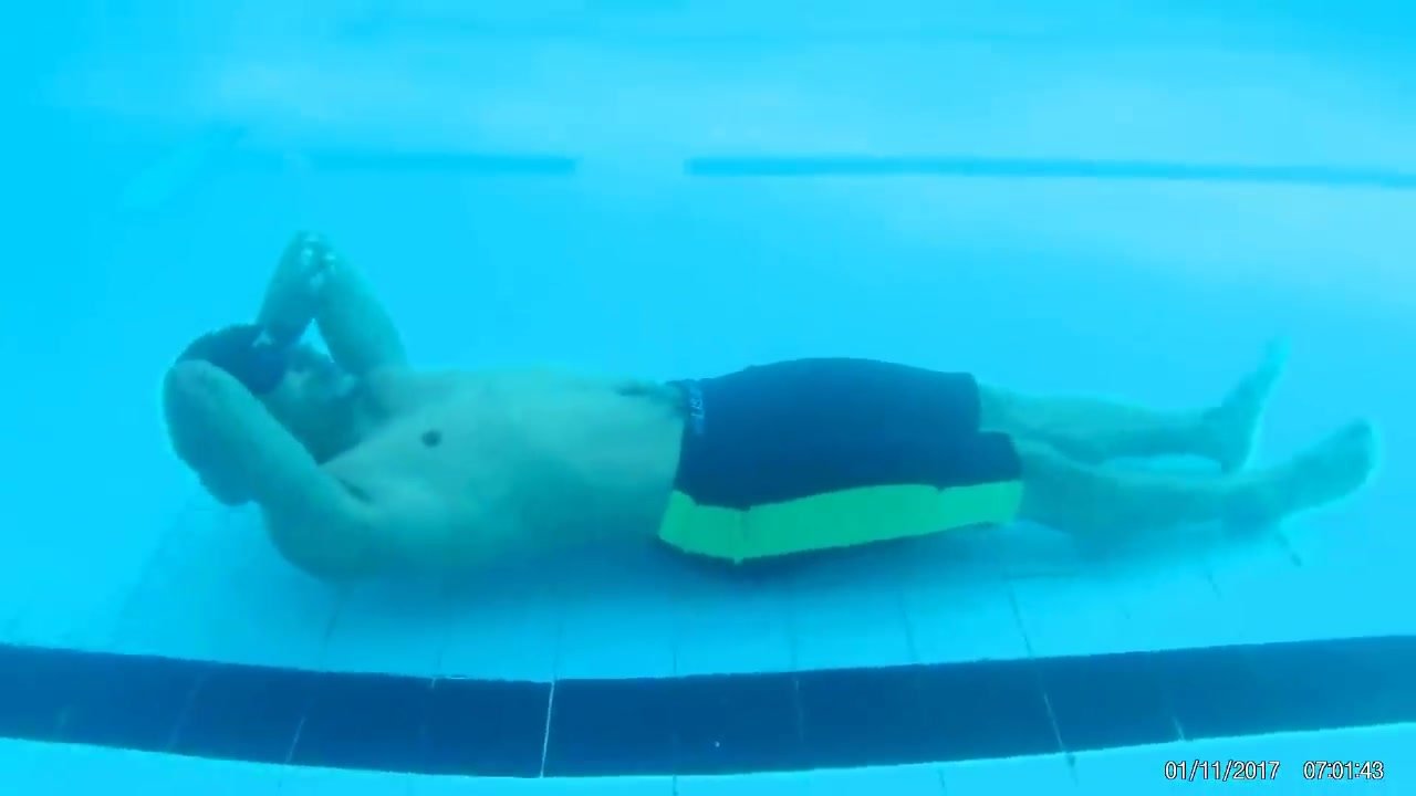 Underwater arab cutie lying on the bottom