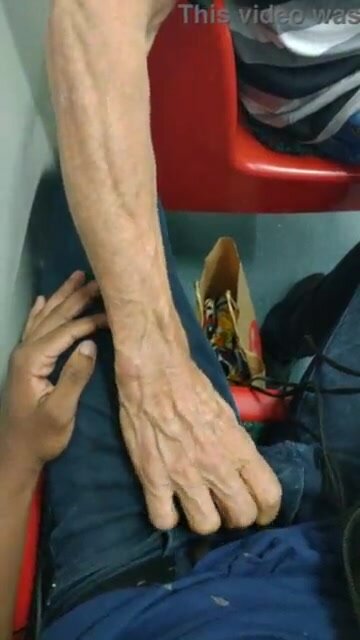 Groping his bulge on the subway