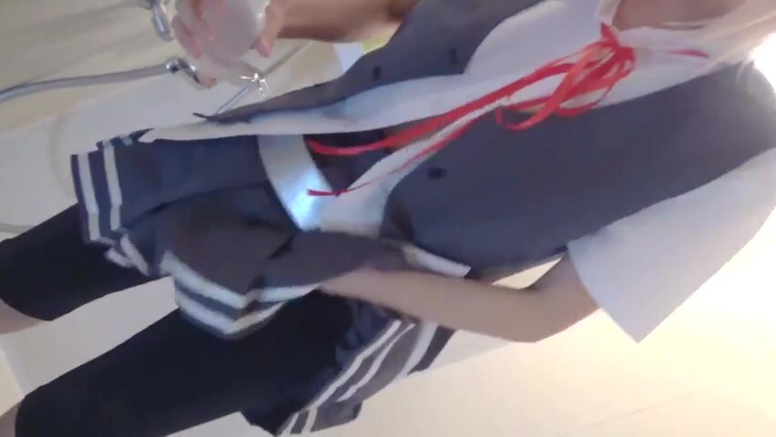Cosplayer washing the vagina with a portable bidet