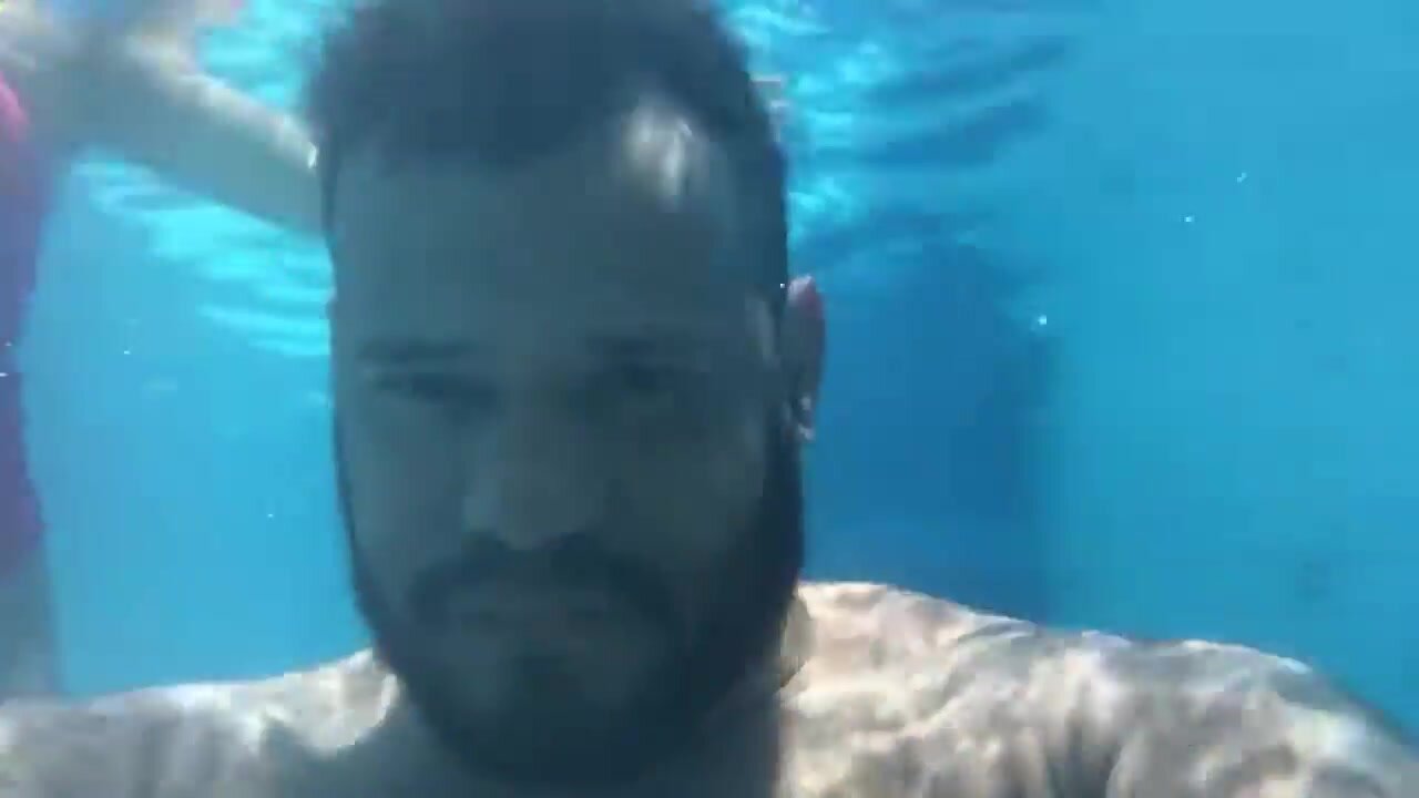 Beefy brazilian barefaced underwater in pool