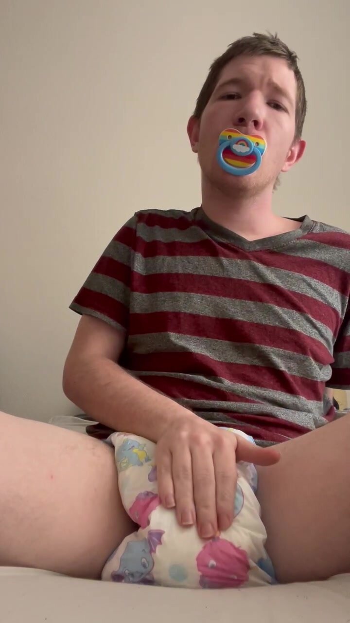 Diaper boy showing off his super wet padding