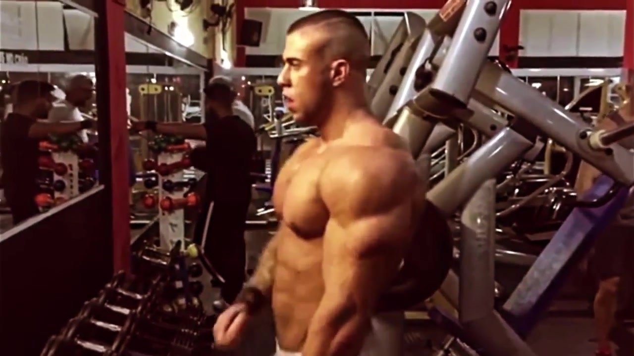 Sexy Bodybuilder posing in the gym