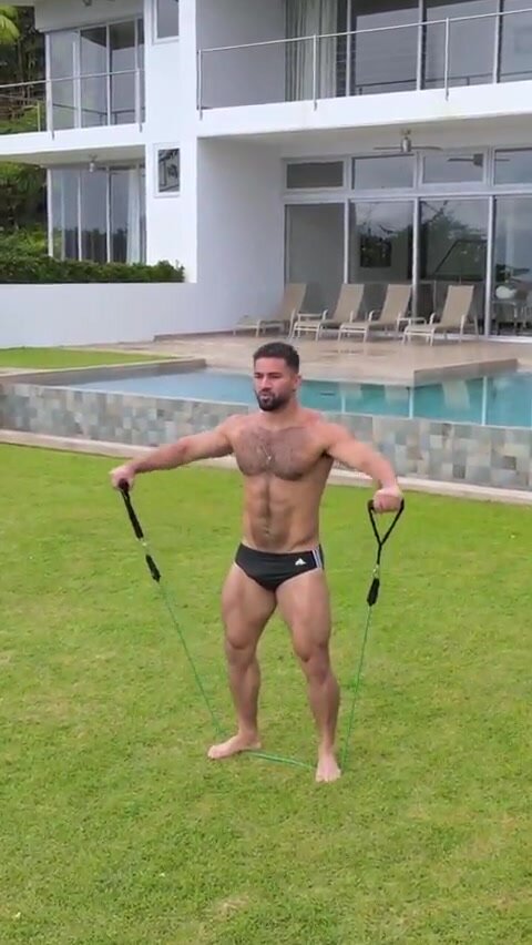 Hot hairy muscle guy working out