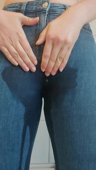 She wets her jeans while rubbing herself
