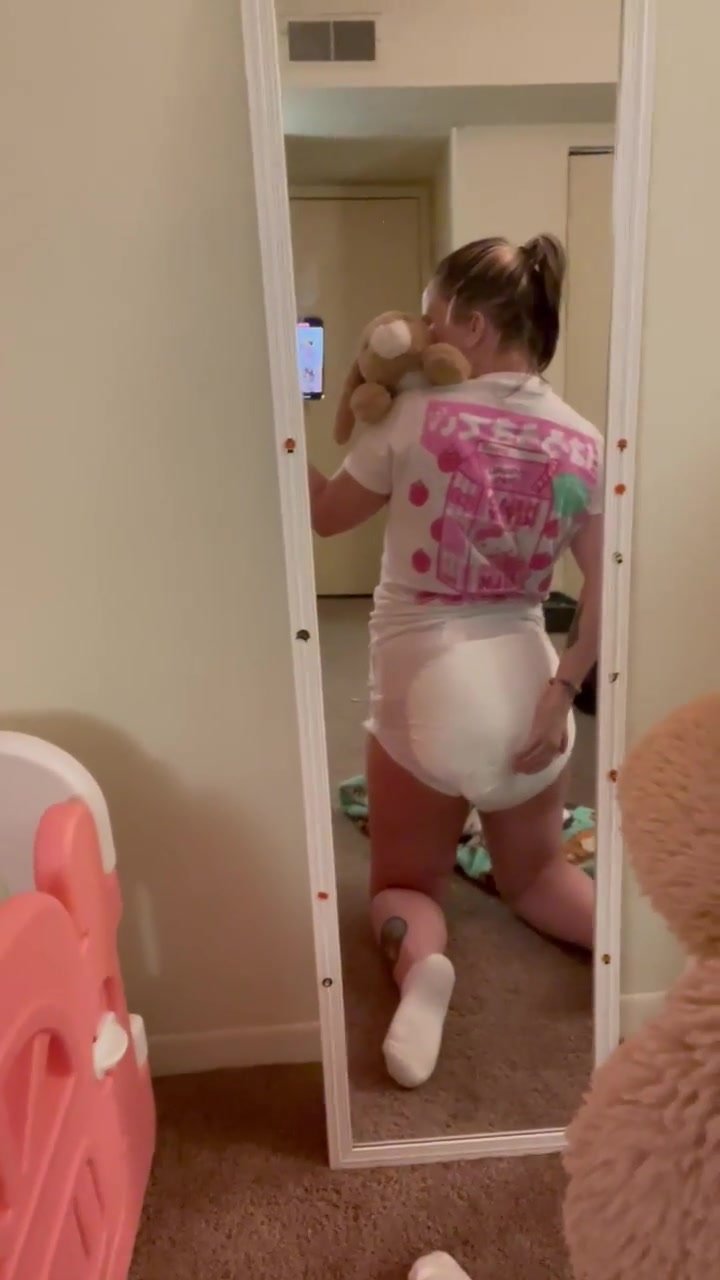 Messy diaper girl squishing