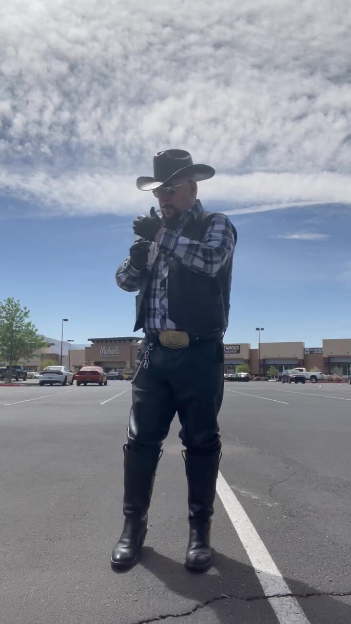 Leather cowboy smoking - video 2