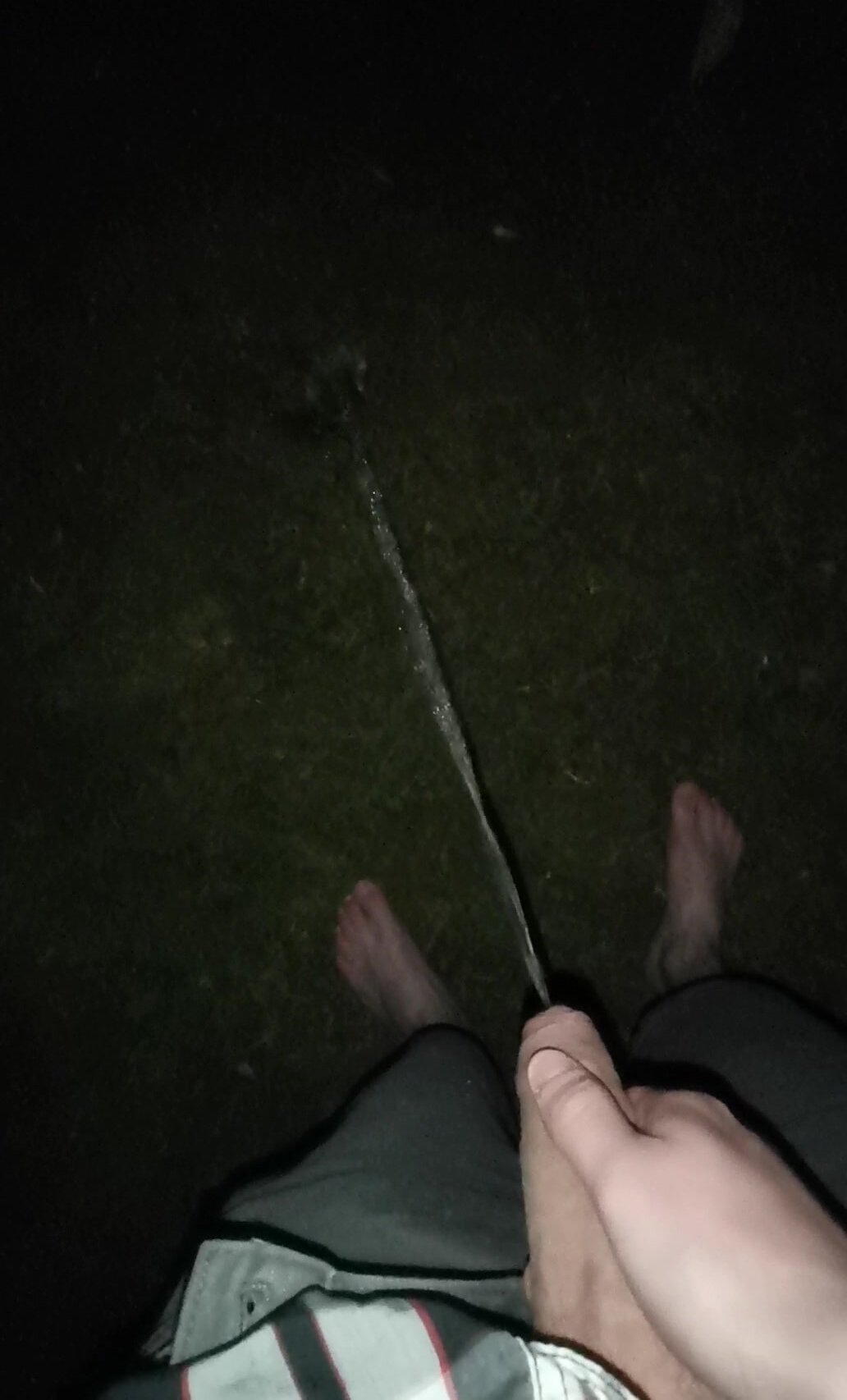 Barefoot Twink pissing outdoor