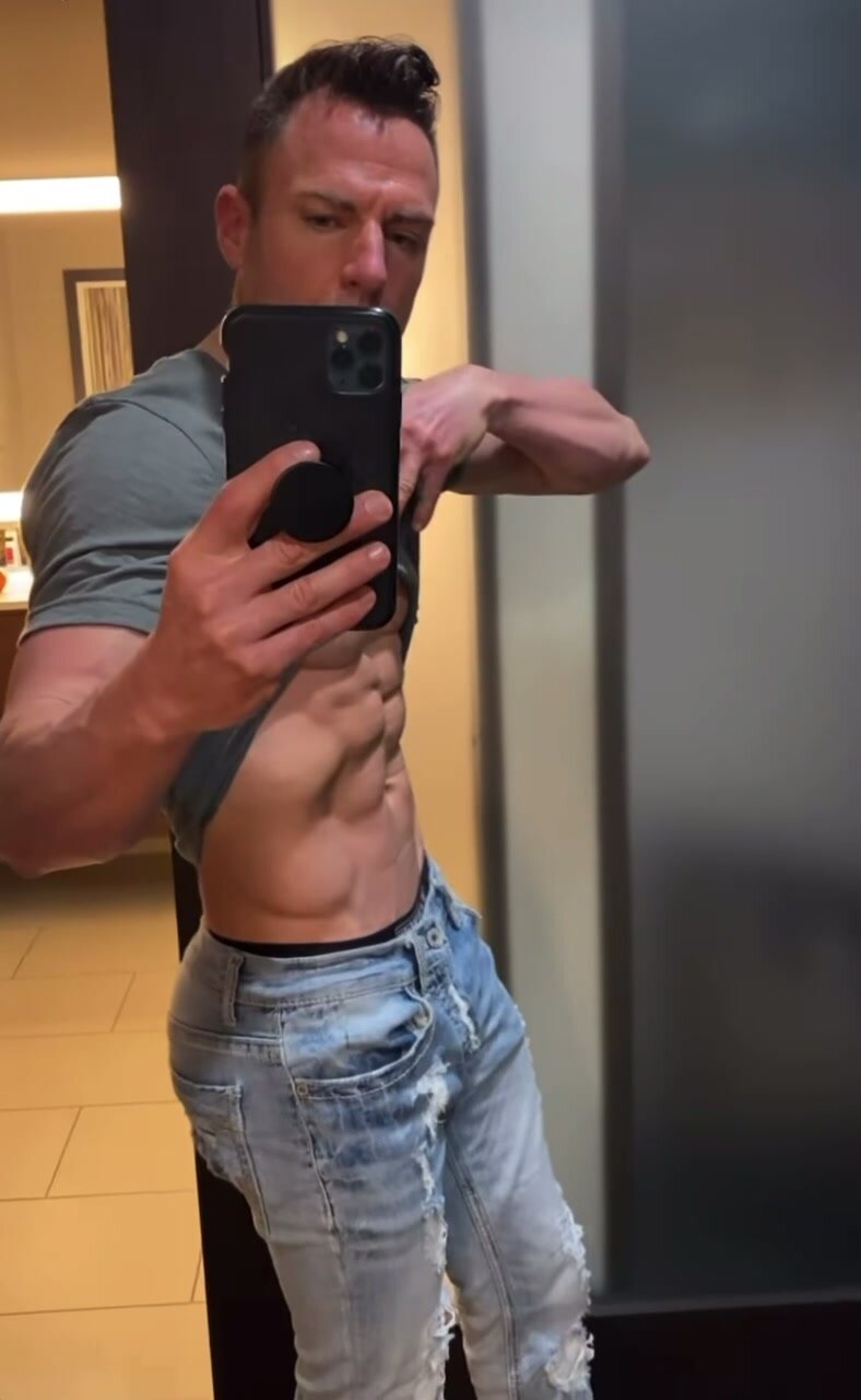 Muscular guy showing off body