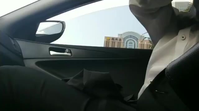 man in suit relax himself in the car