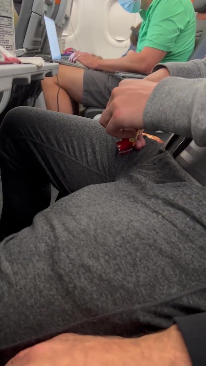 Twink gropes freeballing daddy on plane