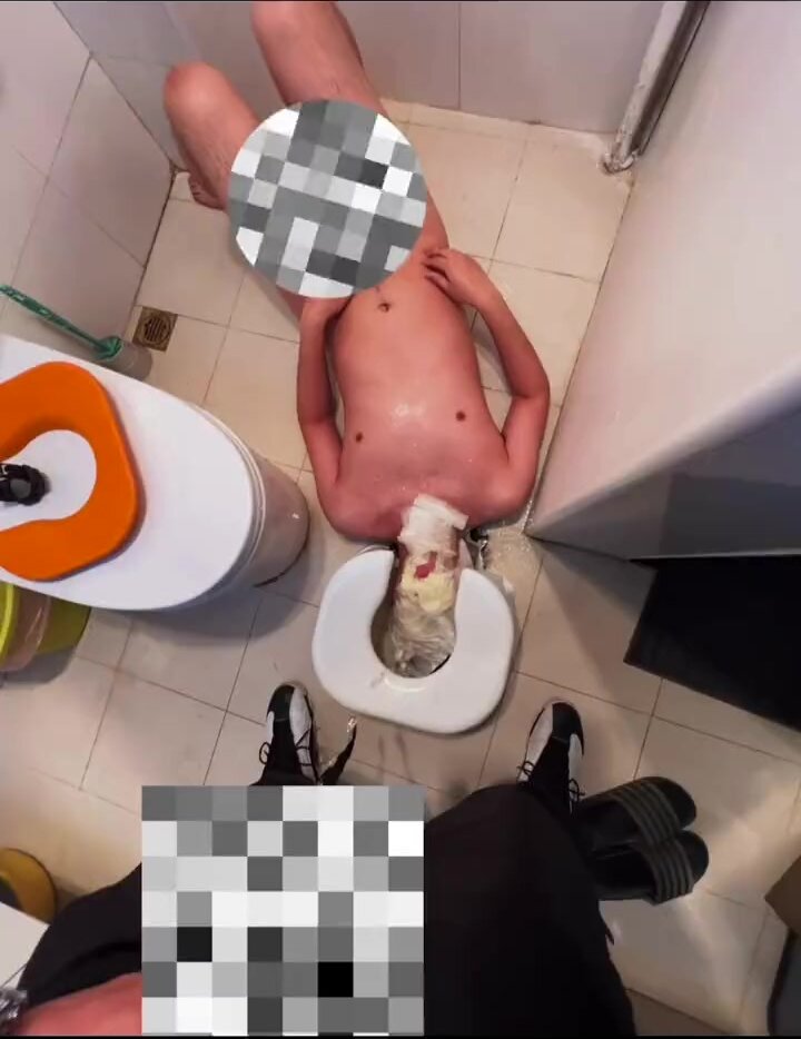 master pissing his slave at toilet