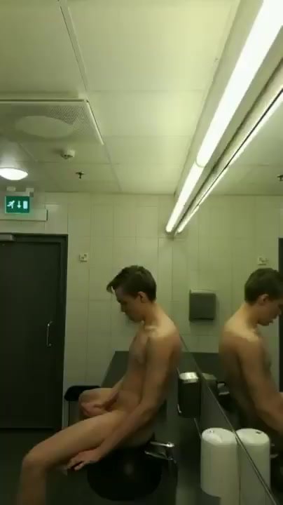 Young guy naked in public restroom