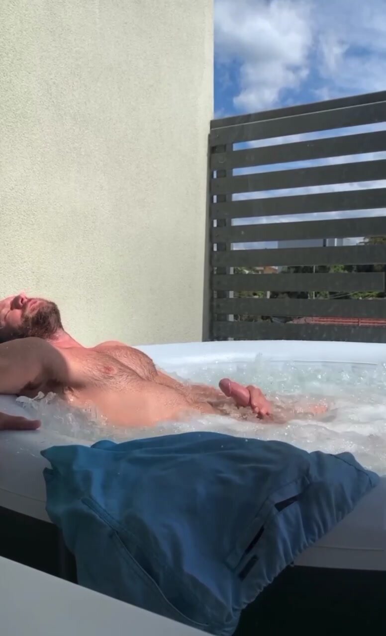 Hairy dad jerks off in public hot tub on balcony