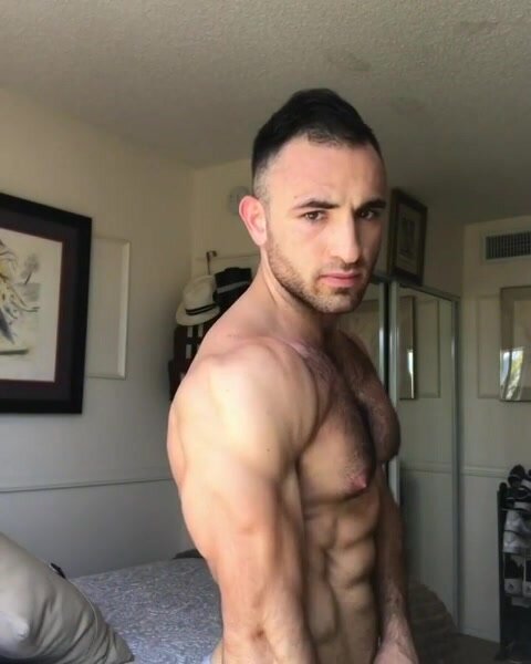 hairy latin with gyno nips flexing