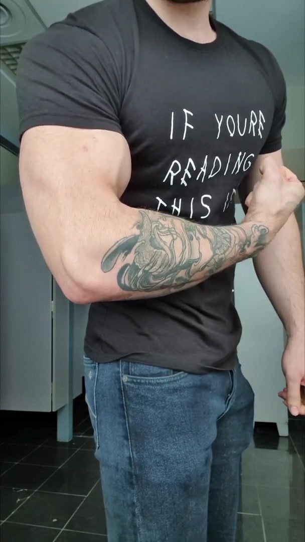 Flexing Arms in tight T-Shirt