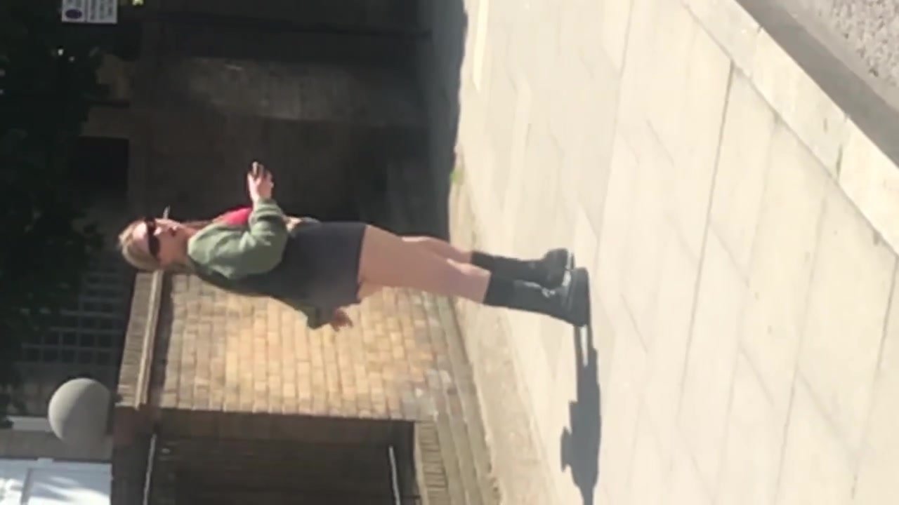 BLONDE SLUT IN PIGTAILS AND MINI SKIRT TAKING A STROLL