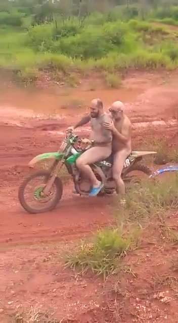 Men riding a motorcycle naked in ride